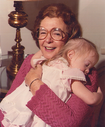 Dr. Gertrude Barber cradling baby